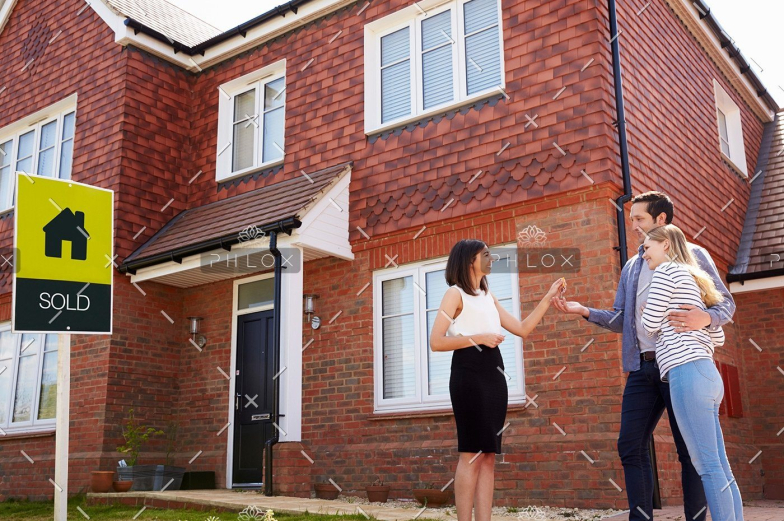 demo-attachment-105-young-couple-collecting-keys-to-new-home-from-PJC4FXU